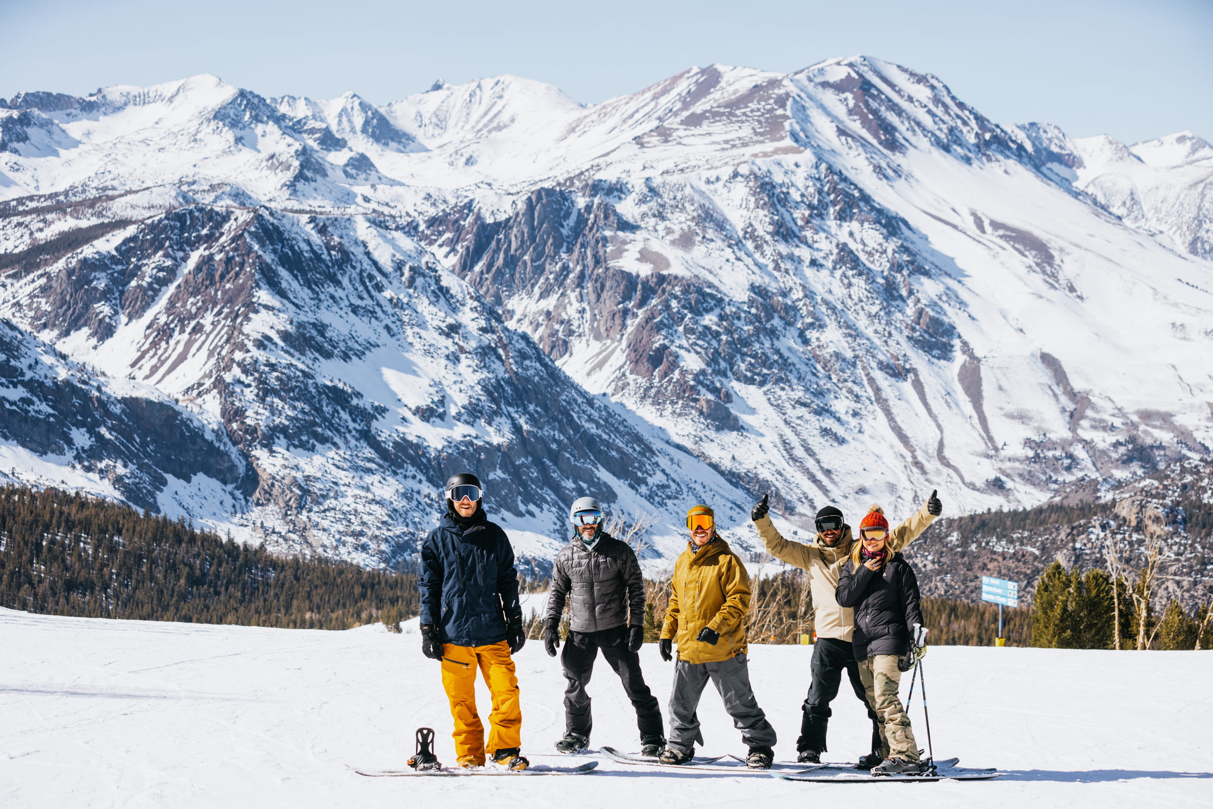 Group of snowboarders out in the mountains